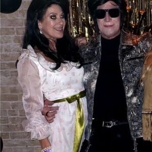 Vintage white floral with green satin bow .